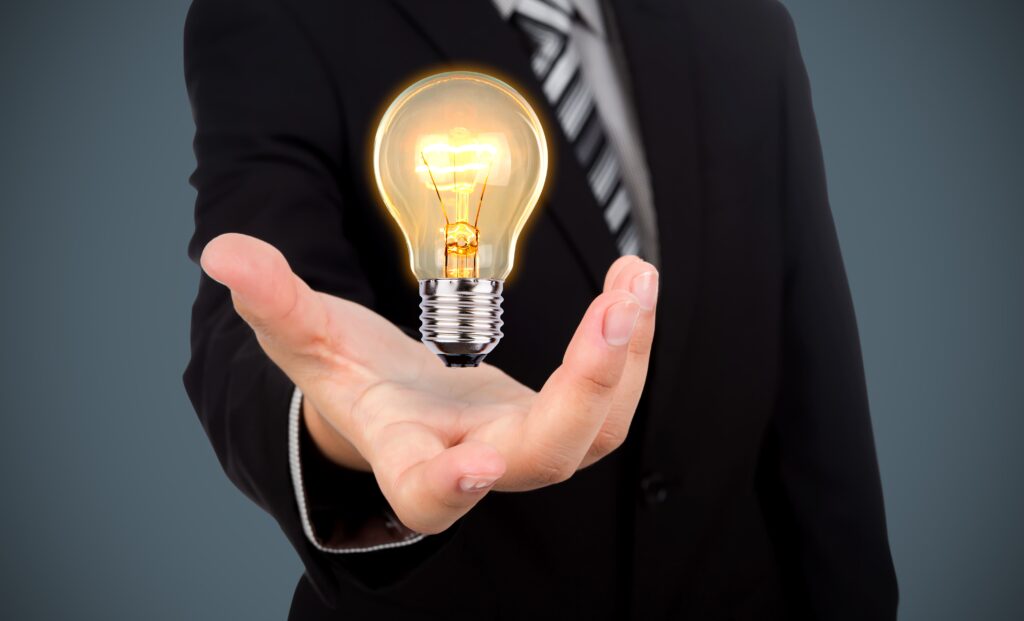 businessman with light bulb his hand min