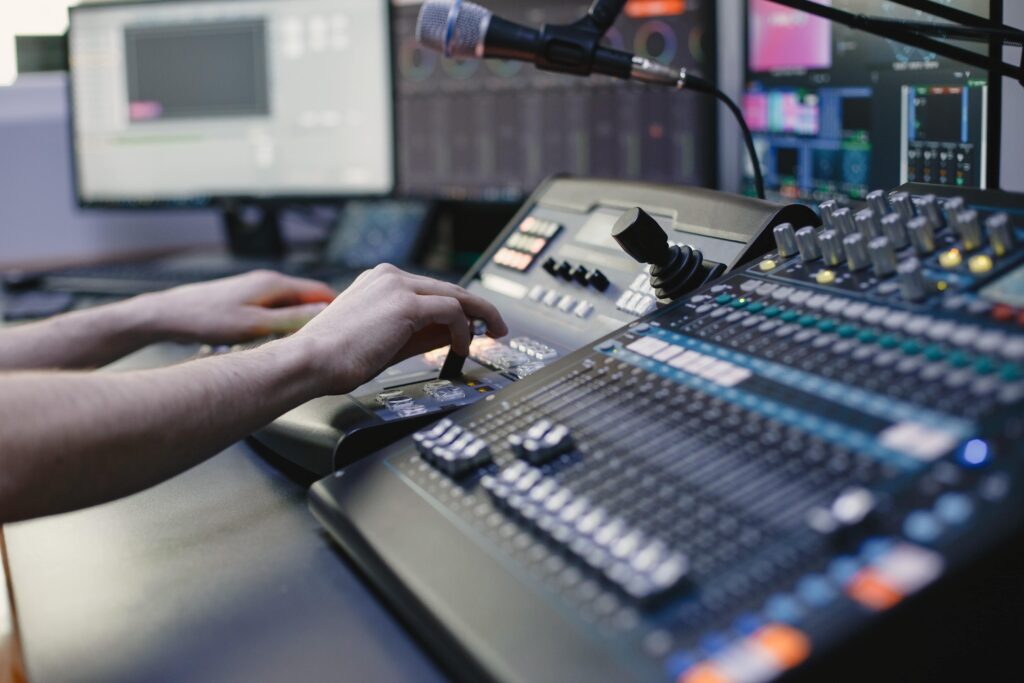 close up sound engineer hands recording music min
