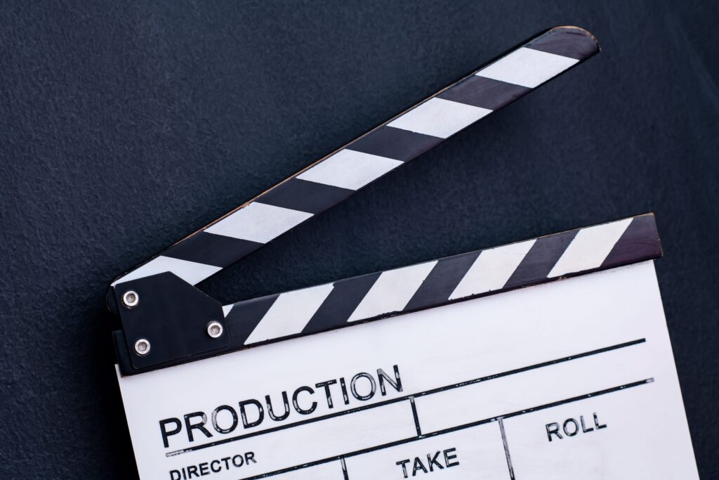 video production movie clapper cinema action cut concept black chalkboard background min